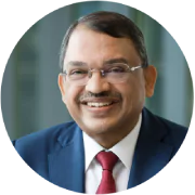 Close-up photograph of Sunny Verghese's face smiling