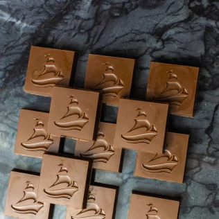 Chocolate squares with the deZaan logo on them