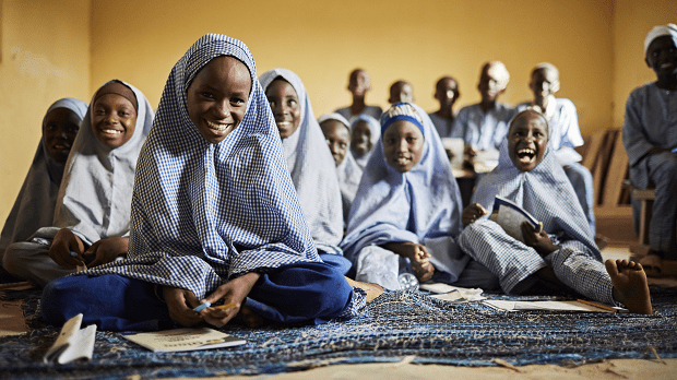 Smiling children photographed in class in Nigerian school