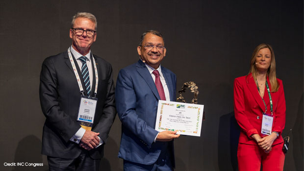 INC handing an corporate golden nut award to ofi 