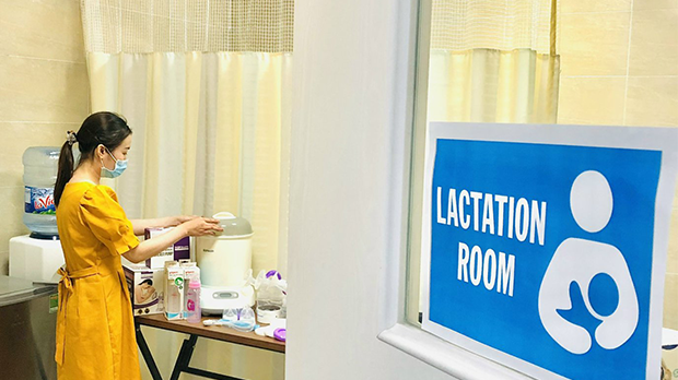A woman organizes supplies in the lactation room