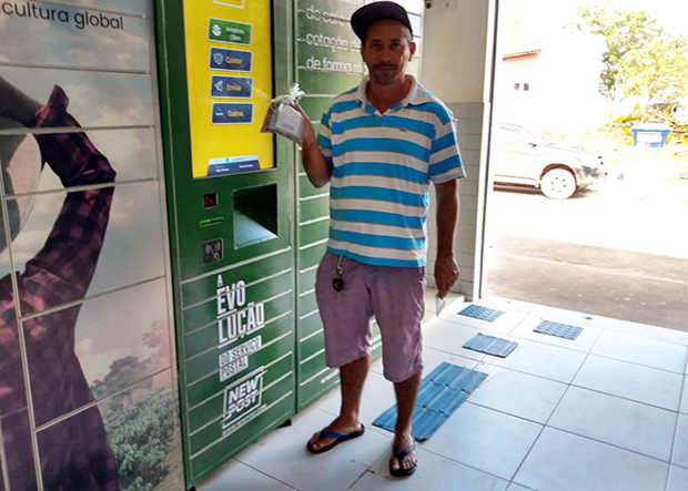 Brazilian man posing and holding up something in this right hand
