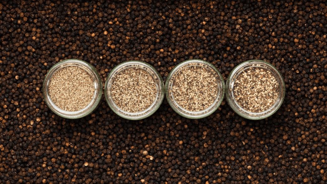 Crushed pepper in a four small glass containers