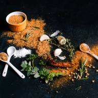A mix of spices scattered across a table