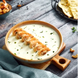 A dish of prawns cooked in a creamy cashew paste with methi