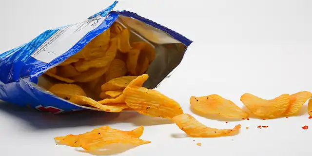 A bag of opened chips in a blue bag