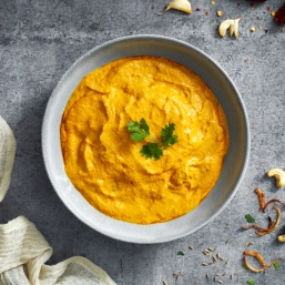 A bowl filled with yellow gravy