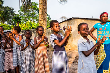 Children photographed standing in line outside a school in Cote Divore