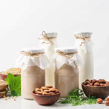 Four diary alternative drinks filled in jars