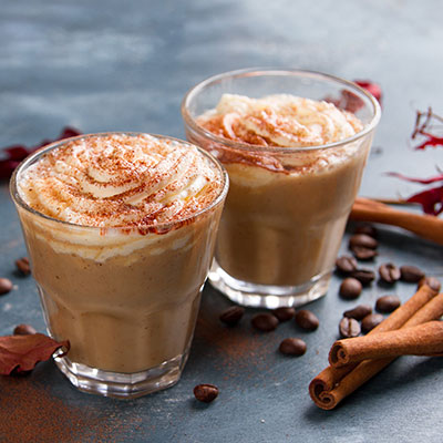Close up shot of two creamy colored warm beverages