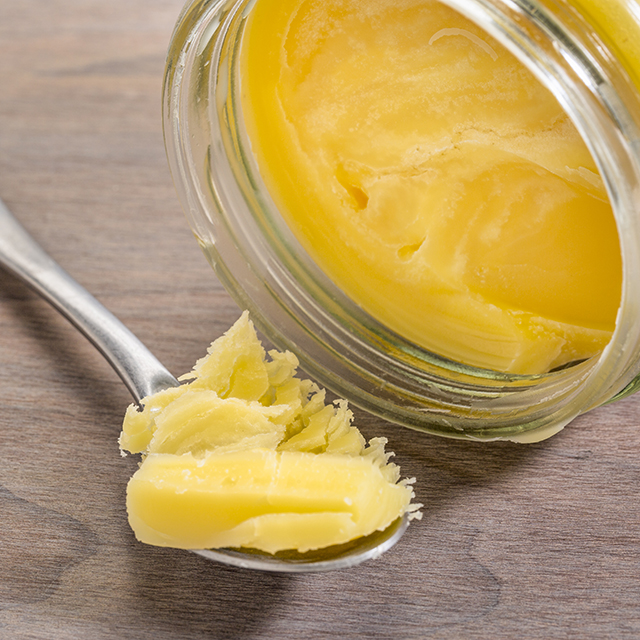 Close up shot ghee on a spoon
