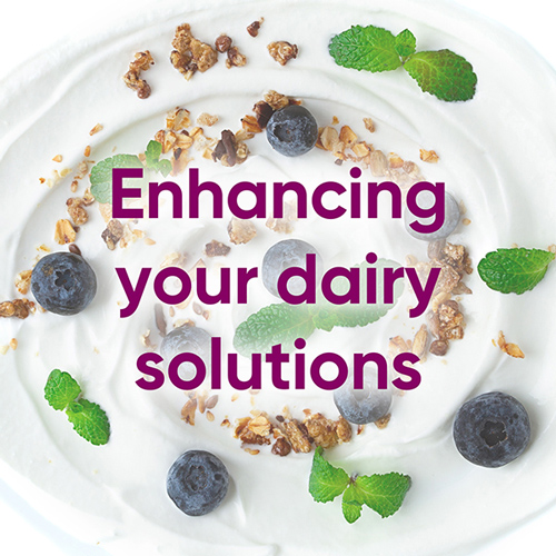 Yogurt sprinkled with nuts and berries with the words enhancing your dairy solutions
