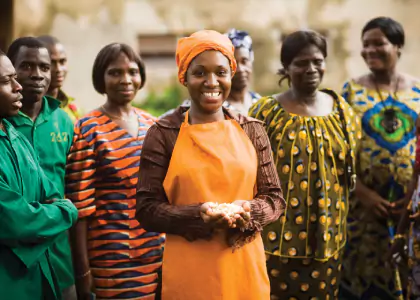 A small group of women and men smiling