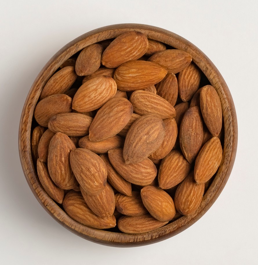 Close up shot of almonds in round bowl
