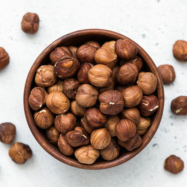 Close up shot of unpeeled hazelnuts