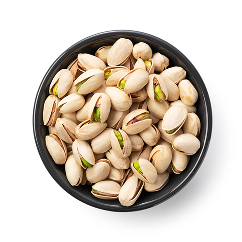 Close up shot of pistachios still in skin