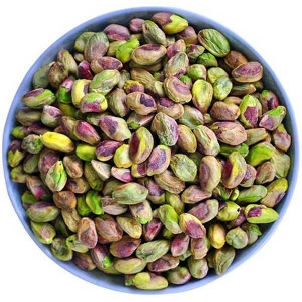 Close up shot of purple and green colored pistachios