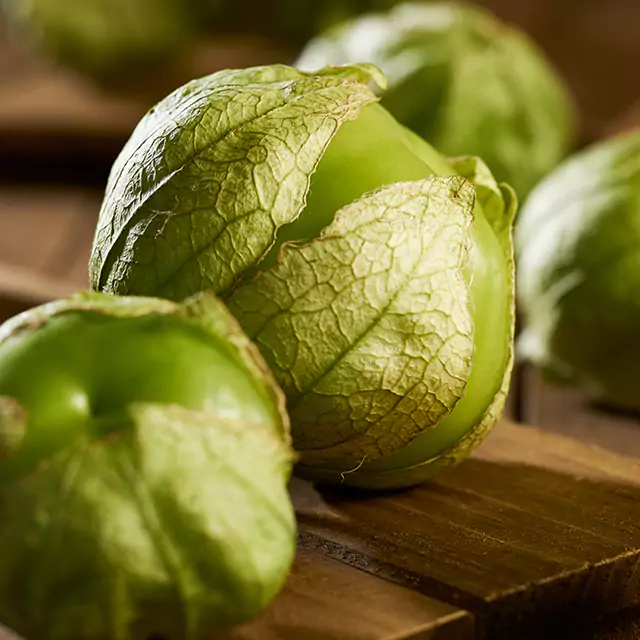 Close up shot of unpeeled  green tomatillos