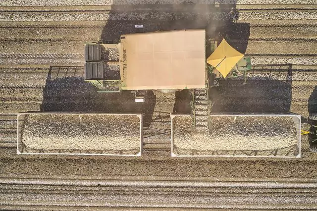 Arial shot of a tractor harvesting crop