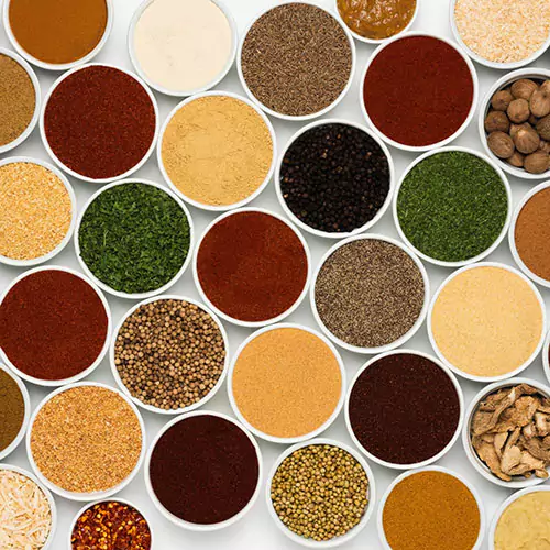 Many different spices presented in white cups